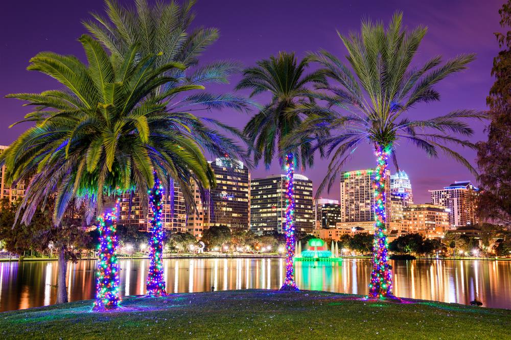 Orlando, Florida, USA downtown skyline at Eola Lake