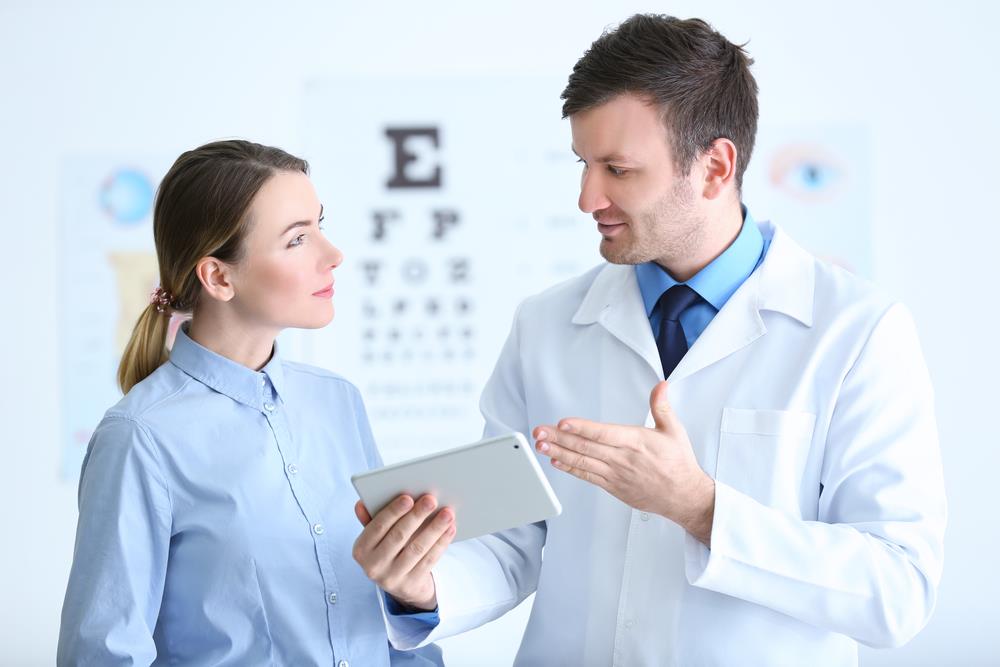 an optometrist assisting a patient in his practice