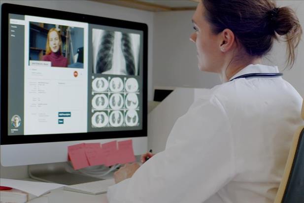 doctor having a telemedicine visit with a patient on her computer