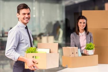 Two young professionals preparing to relocate for work