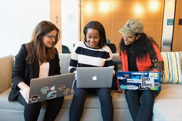 Diverse employees working on laptops