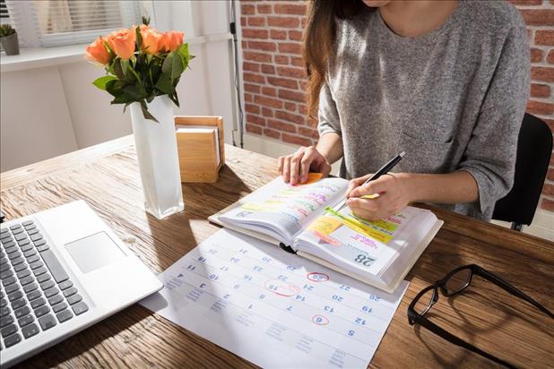 Woman working on calendar