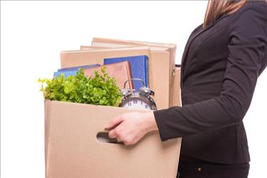 woman carrying a moving box