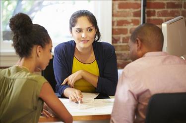 Certified Financial Advisor discussing investment opportunities with clients