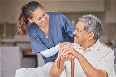 home health aide smiling at her patient