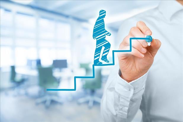 male job seeker drawing himself walking up a flight of steps to represent career growth