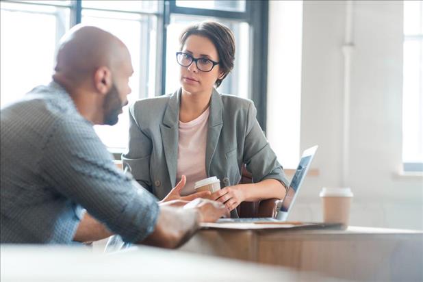 Man meeting with career coach for help finding a job