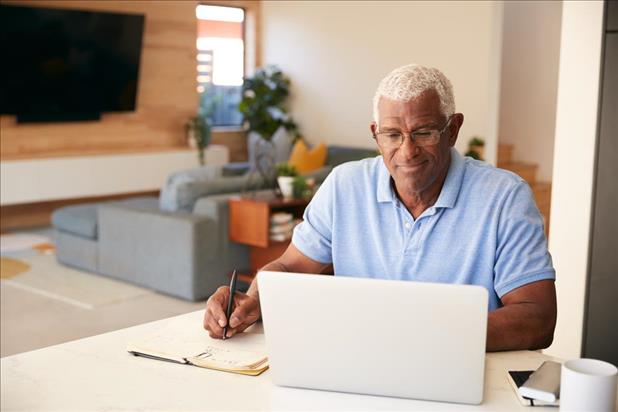 man using laptop to network online