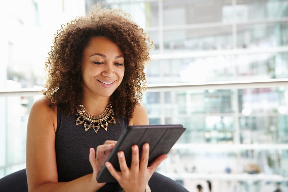 Job seeker using tablet to search for opportunities