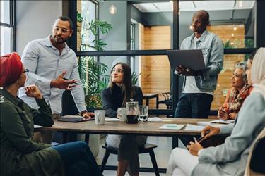 diverse team of employees meeting in a conference room