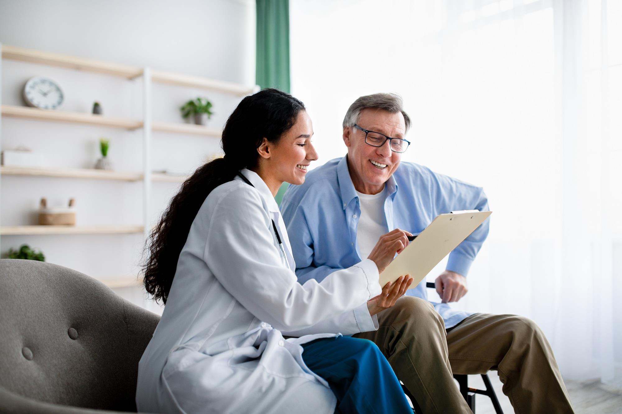 doctor reviewing paperwork with her patient
