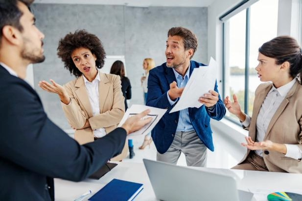 group of arguing employees in an office