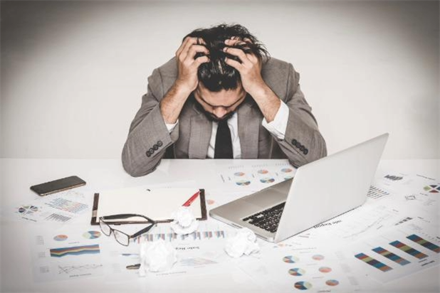 guy frustrated at work at desk