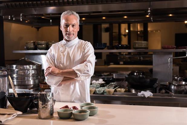 Chef standing in kitchen