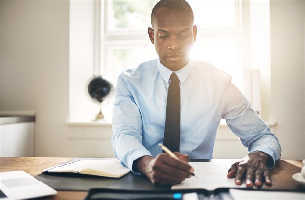 accountant reviewing financial data at his desk