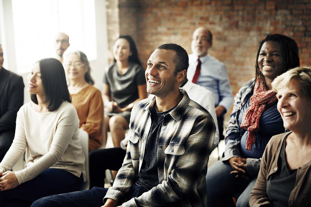 group of employees at a town hall meeting