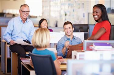 Group of temp workers discussing how to make a temporary job permanent