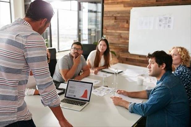 group of ad agency team members meeting at a table