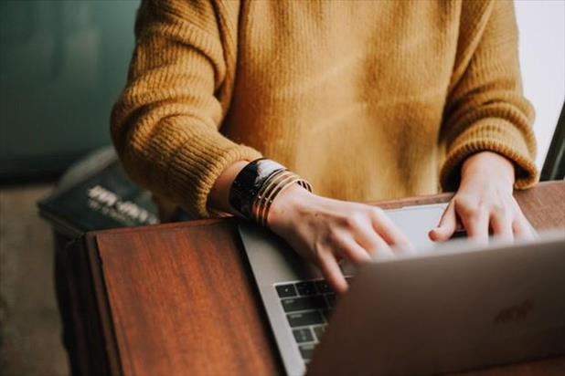 hands typing on keyboard