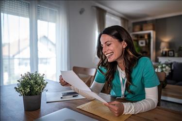 medical professional smiling at an offer letter