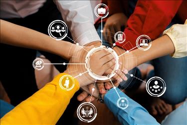 employees putting their hands together with symbols of teamwork in the image