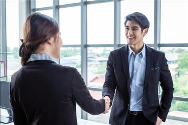 employee and employer shaking hands