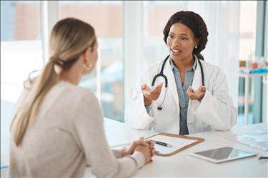 doctor speaking with a healthcare job seeker