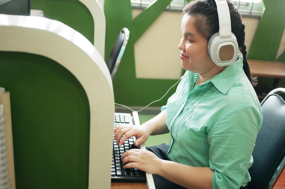 Person with disability at desk