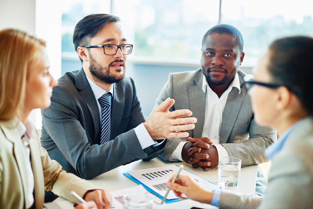 employee meeting with his team to discuss a personal issue