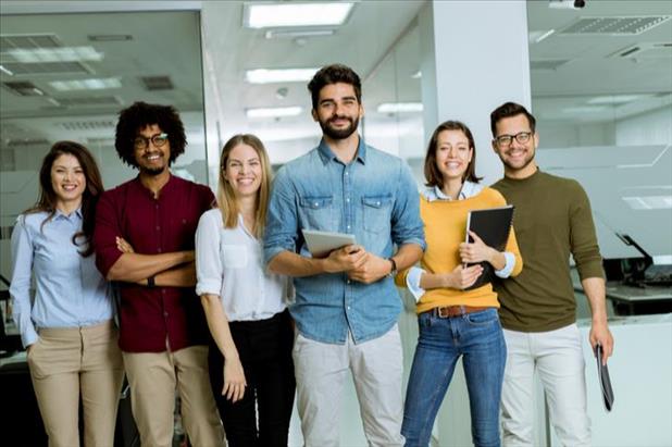 Group of young professionals smiling for the camera