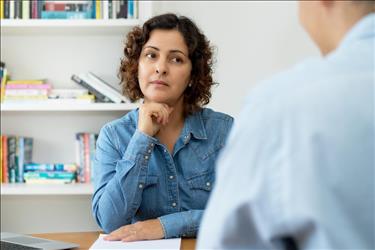 Woman interviewer asking question