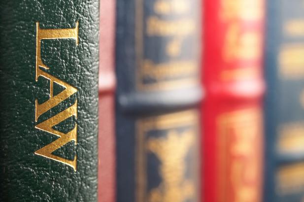 Closeup of several law books on a shelf