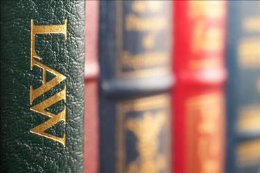 Closeup of several law books on a shelf