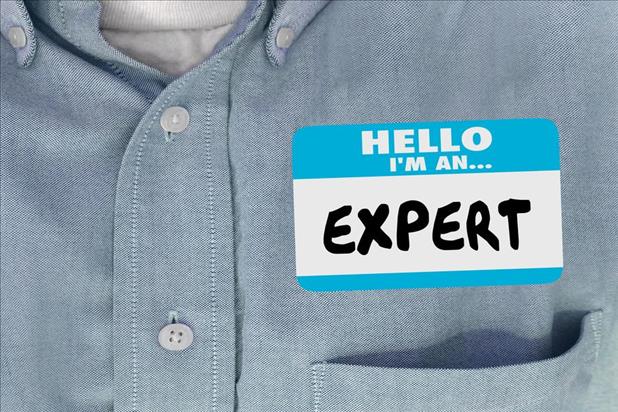 person with expert on their name tag