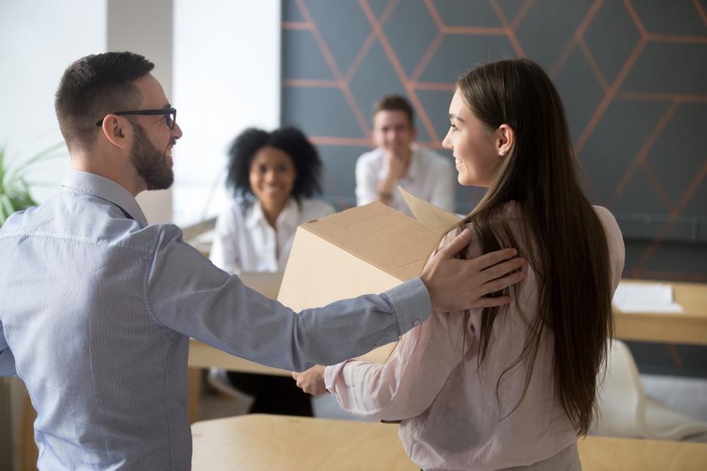 Young professional being welcomed on her first day at a new job