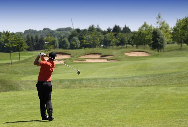 person golfing