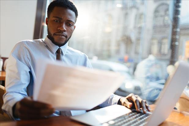 job seeker working on his hybrid resume