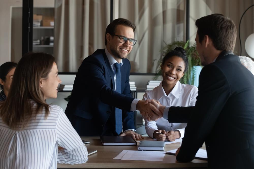 Employees shaking hands