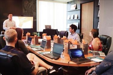 Employees working in conference room