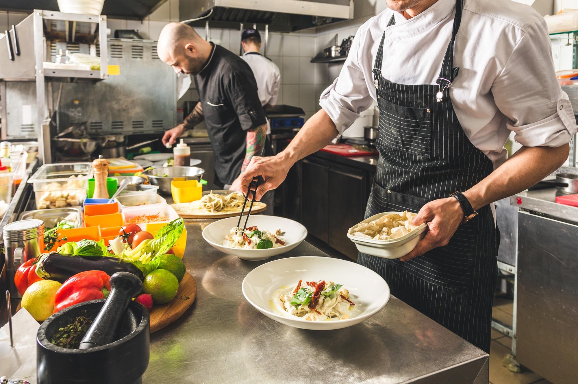 team of restaurant cooks in a busy kitchen