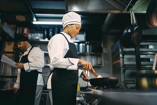 two restaurant cooks working in the kitchen