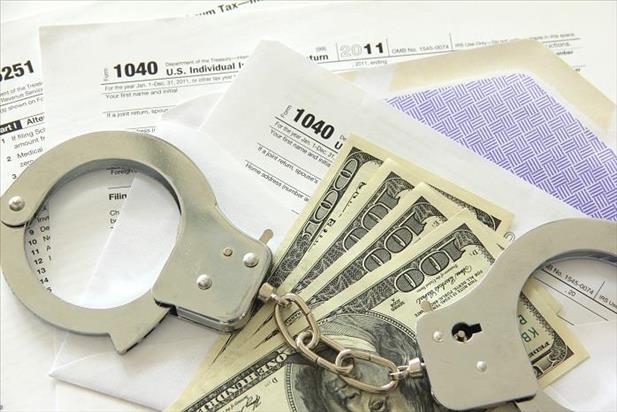 Image of handcuffs, cash, and tax forms