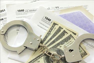 Image of handcuffs, cash, and tax forms