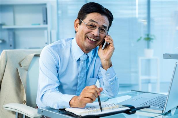 Businessman smiling while talking on the phone