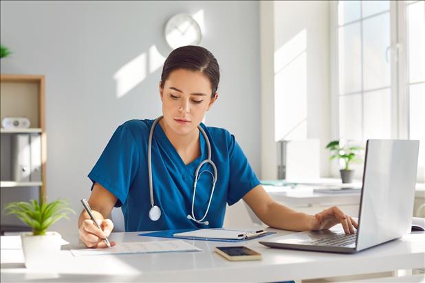 medical professional working at her desk