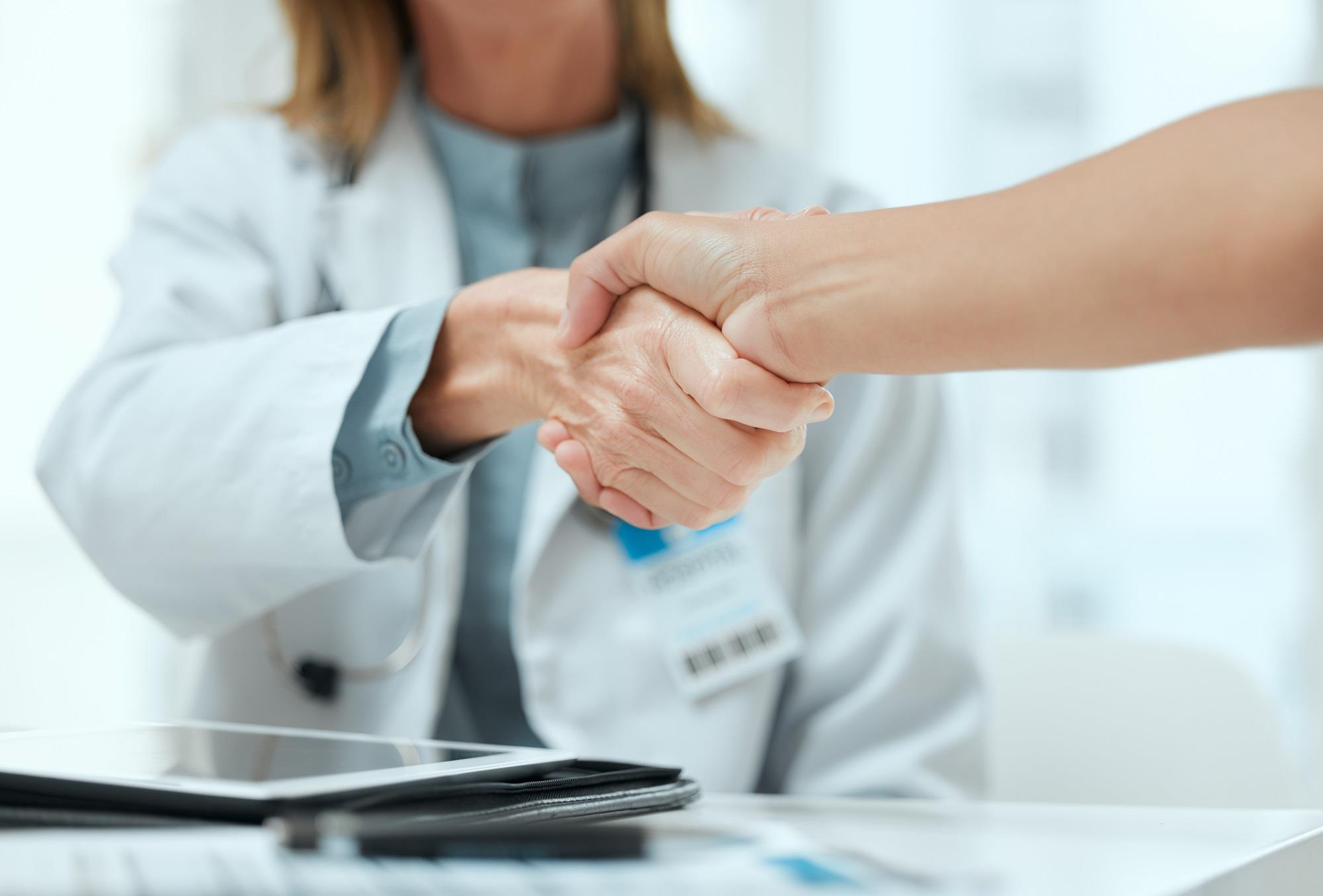 medical team members shaking hands