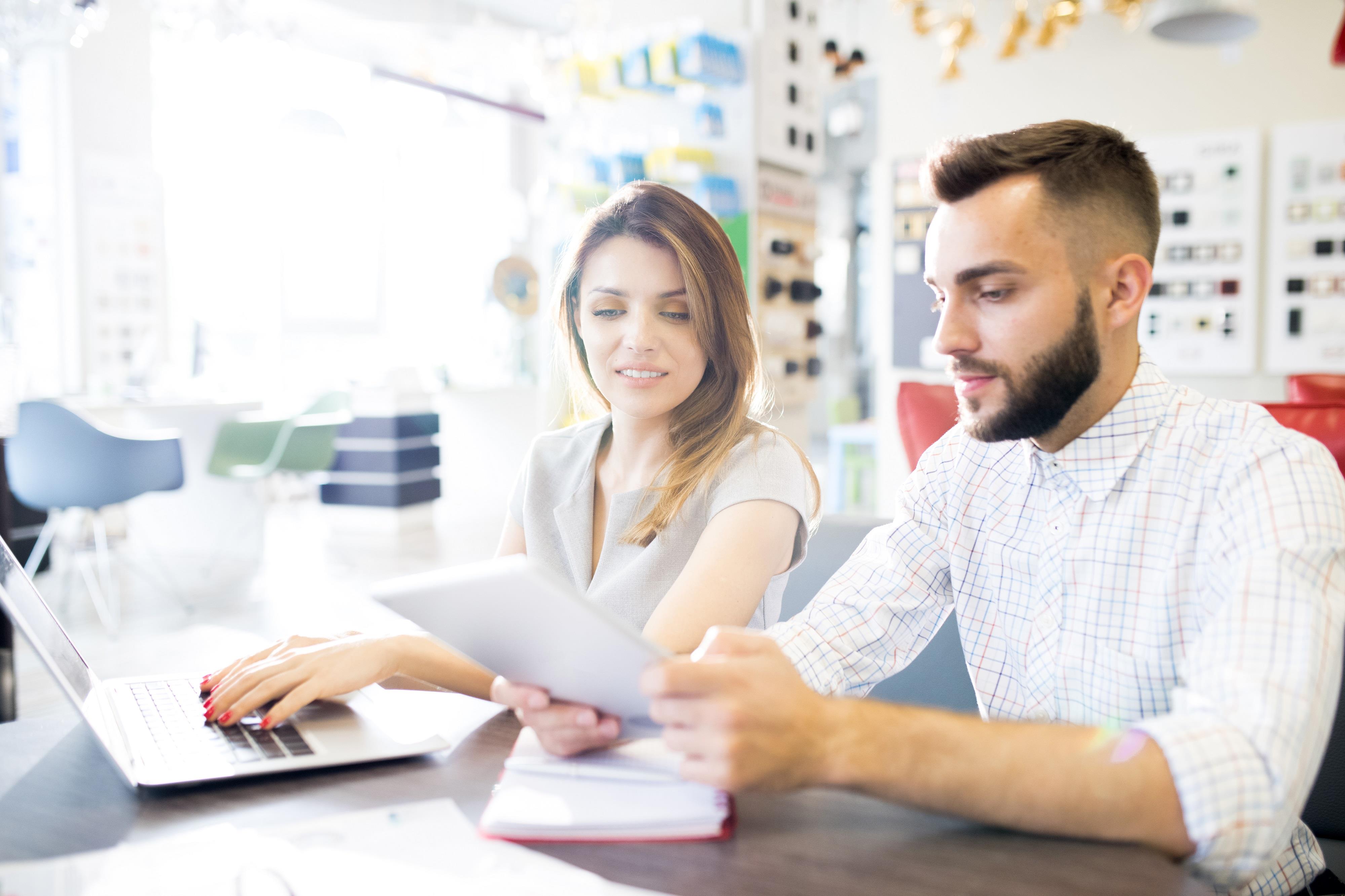 two retail team members working at their store