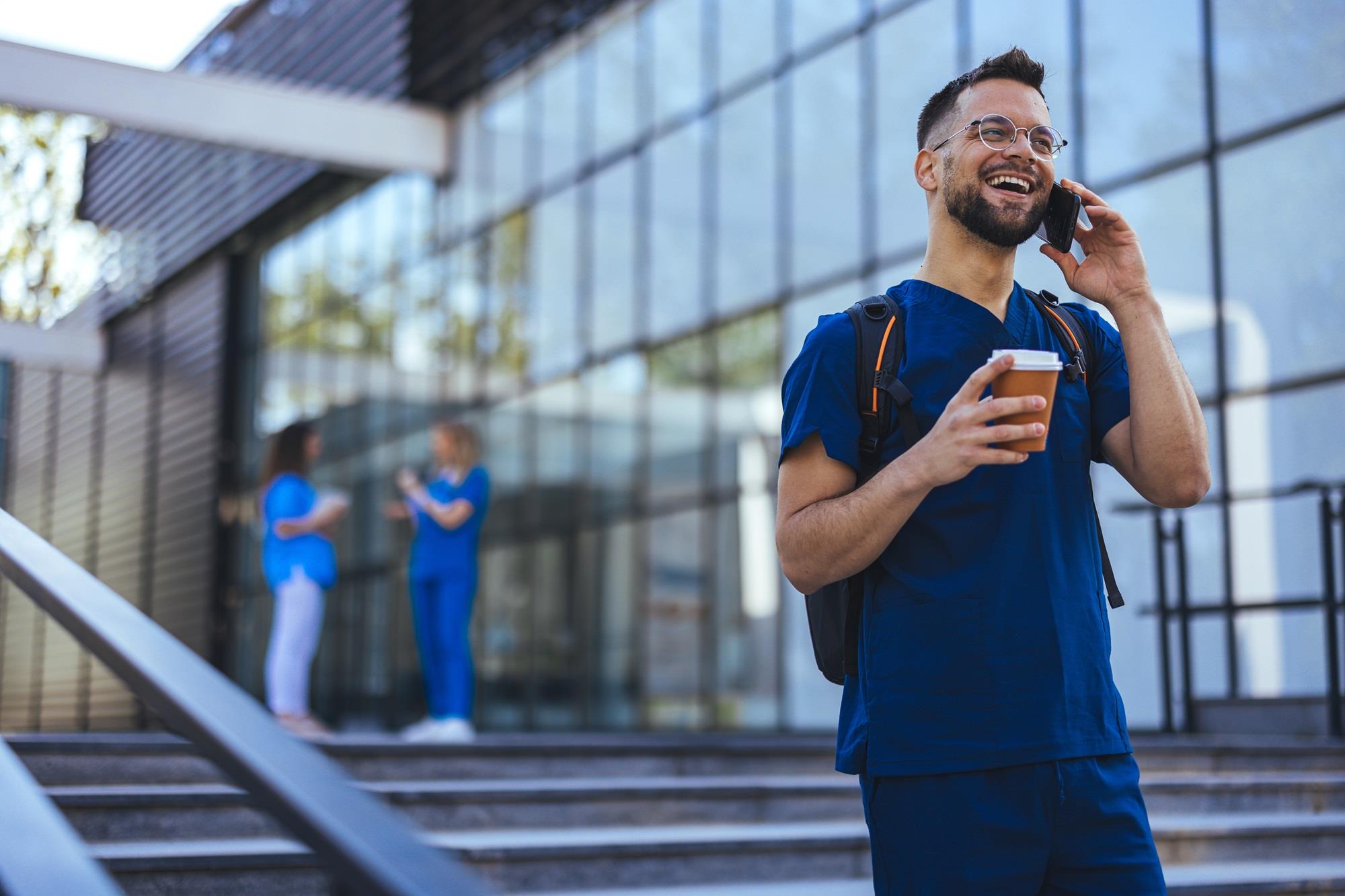 happy hospital worker on the phone