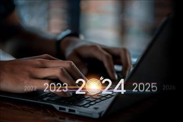 person working on their laptop with 2024 and a bullseye overlaid