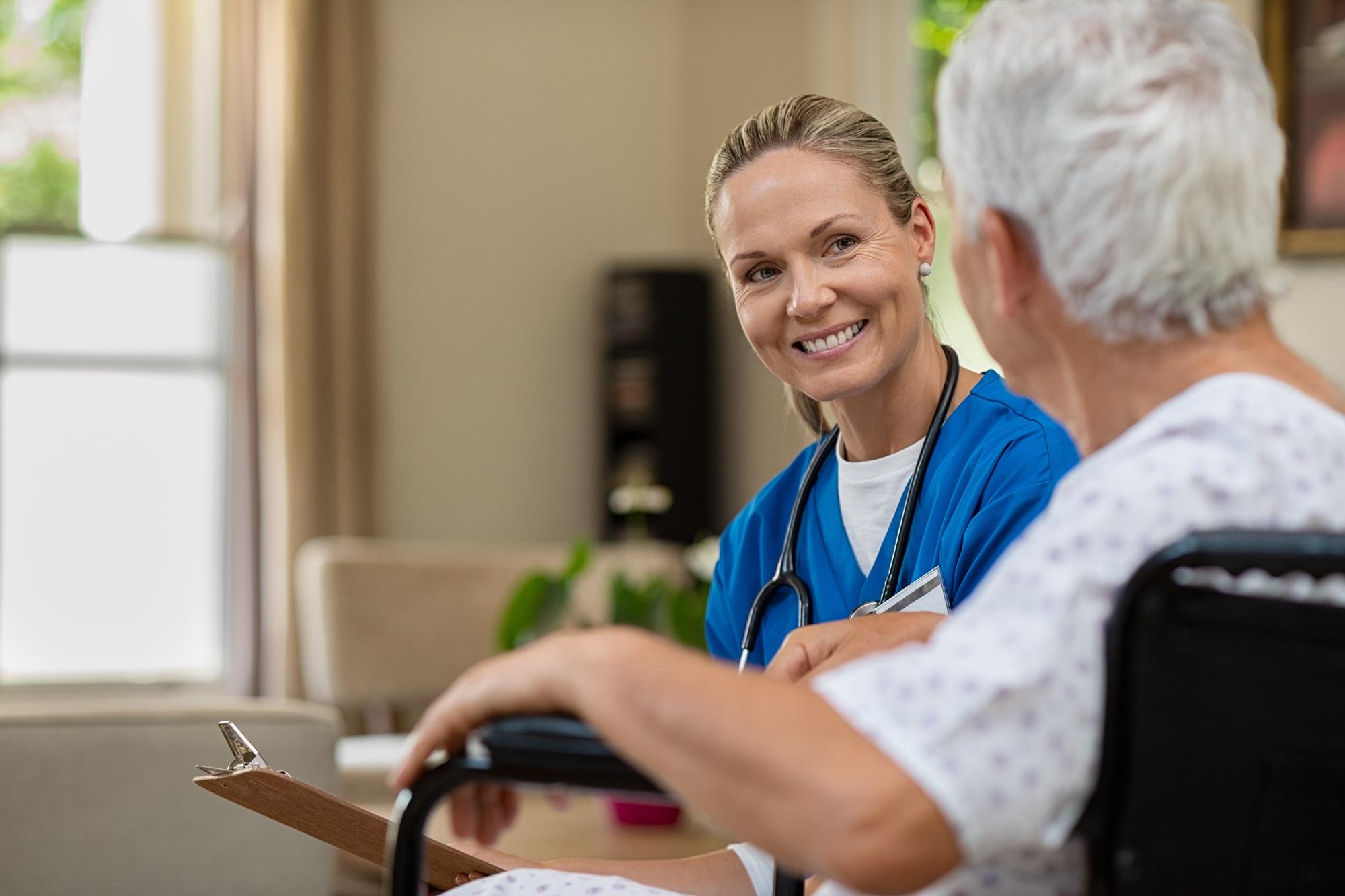 nurse speaking with an elderly patient